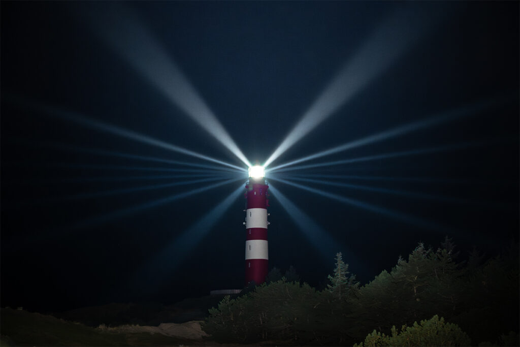 Leuchtturm von Amrum nachts mit Leuchtfeier